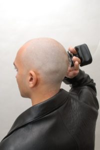 Shaving your head with an electric razor