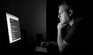 Man in front of a computer