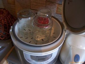 Why is it better to sterilize jars in a slow cooker?