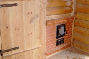 Preparing the walls in the bathhouse for the stove