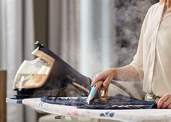 Ironing clothes with a steam generator