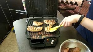 cooking food in an electric grill