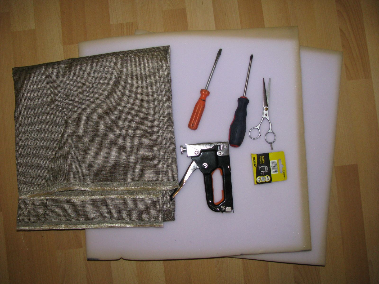 Tools for reupholstering a chair.