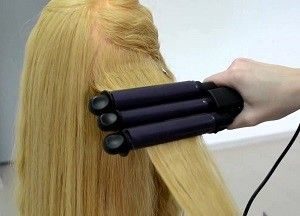 The triple curling iron can both curl and straighten your hair.