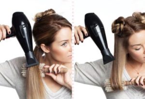 The process of straightening hair with a hairdryer.