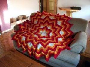 Unusual shapes of a blanket for a sofa.