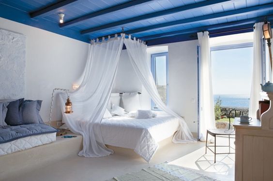 White bed in a Mediterranean interior.