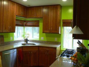 The color of the walls in the kitchen with brown furniture