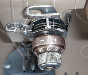 Why does the top thread break in a sewing machine?