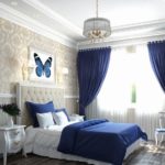 Blue and white bedroom interior.