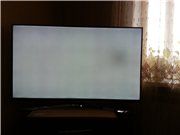 Punto de luz en la pantalla del televisor.