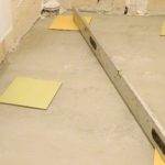 Laying tiles on uneven floors