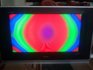 Colored spots on the TV screen.