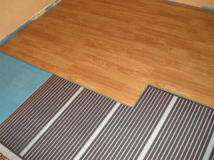 Film heated floor under laminate