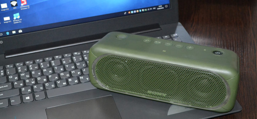 Bluetooth speaker at laptop.