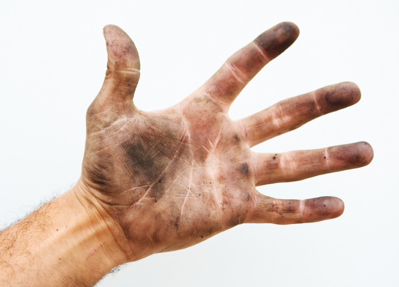 A hand stained with printer ink.