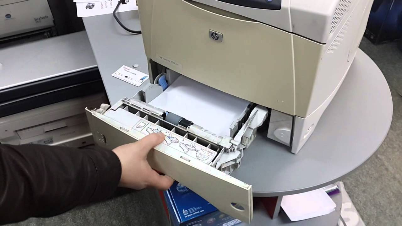 Checking the paper in the printer.