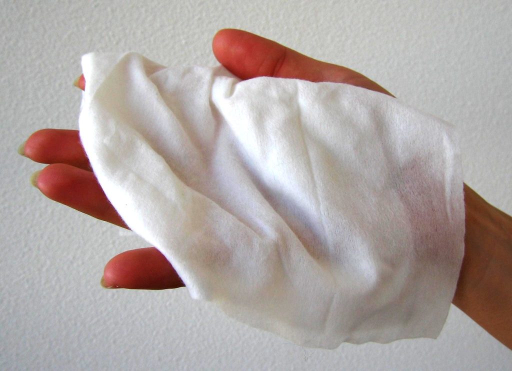 Wet napkin in hands.