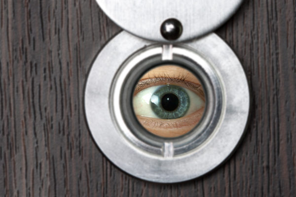 Who invented the door peephole and why?