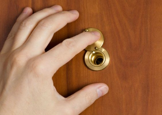 Who invented the door peephole and why?