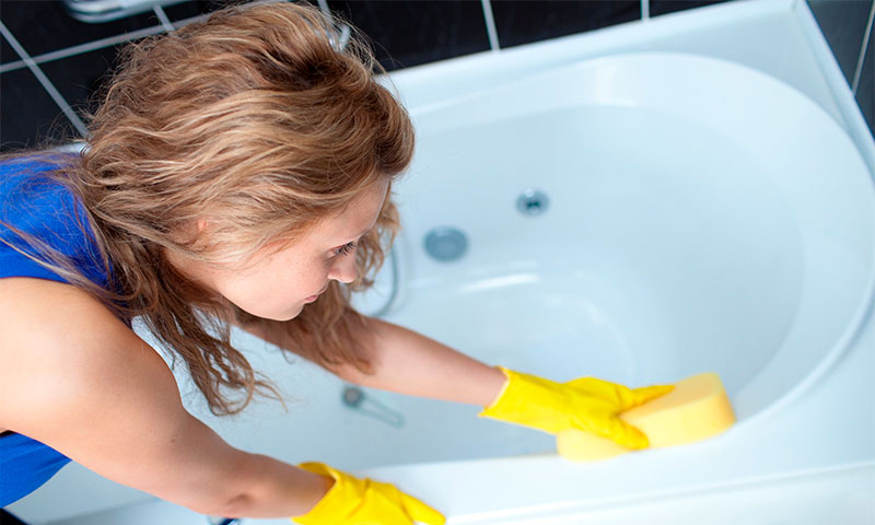 girl cleaning the bath