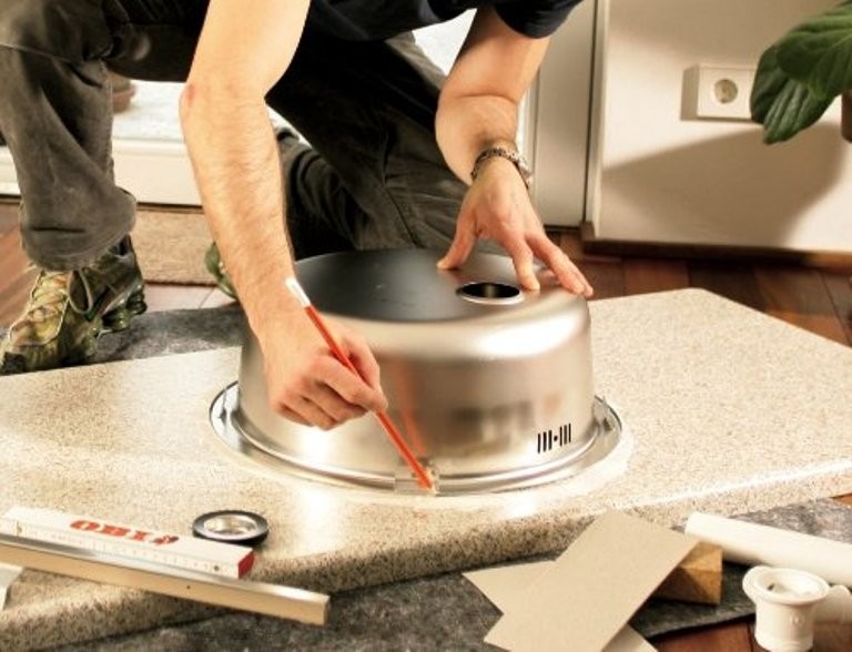 Installation of a mortise sink.