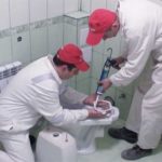 Fixing the toilet with glue.