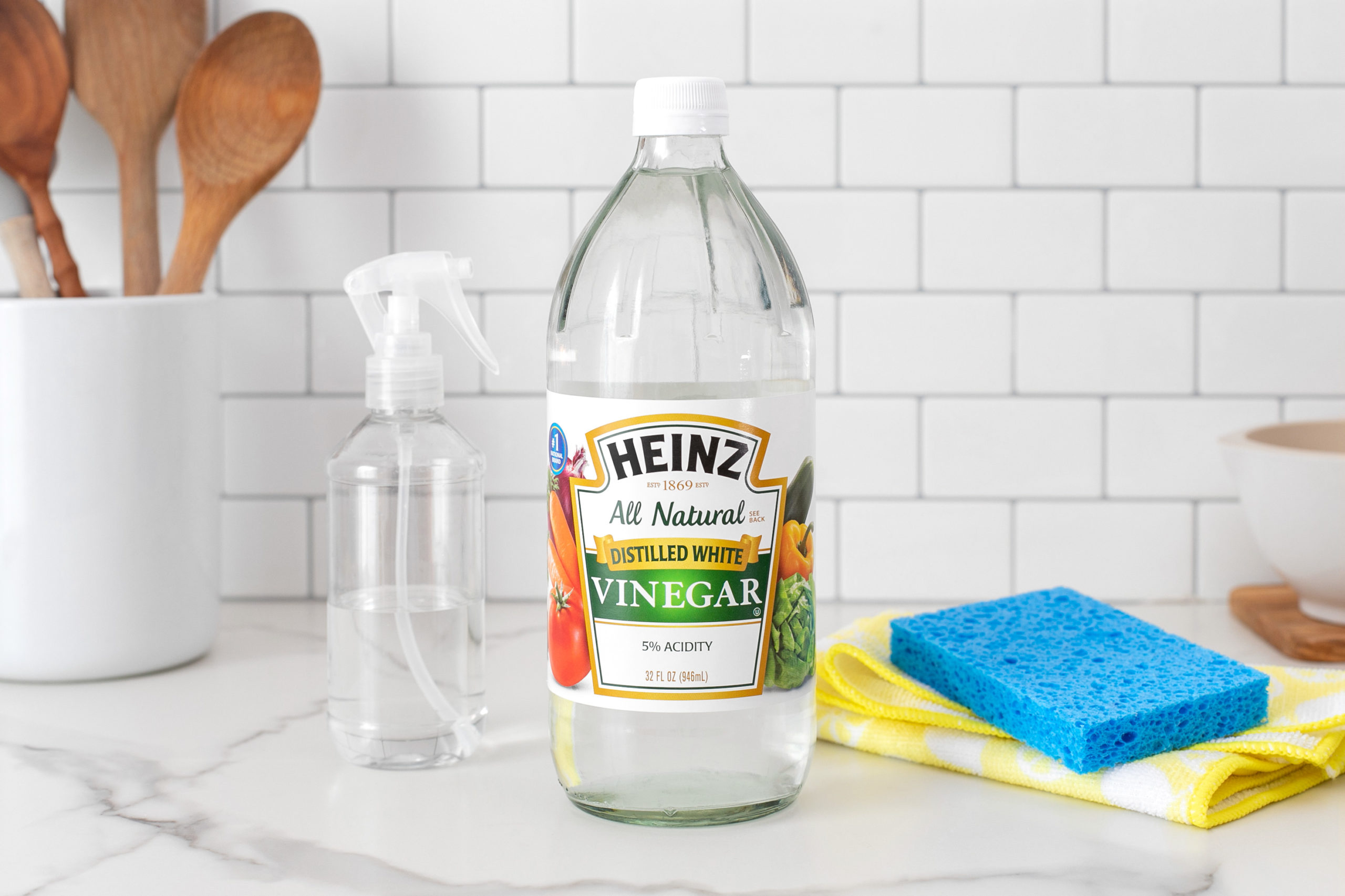 Vinegar, spray bottle and sponges