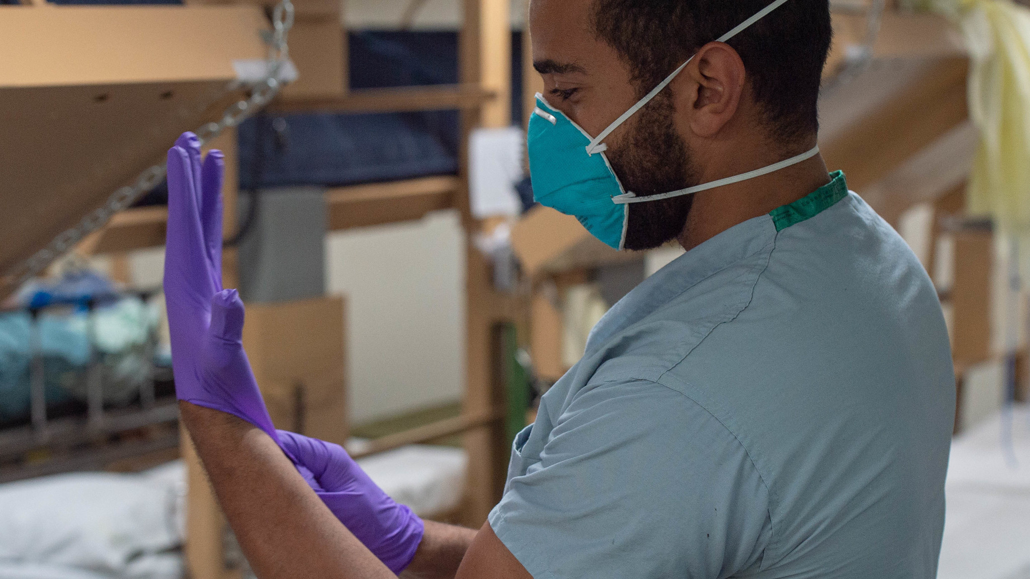 Man in mask and nitrile gloves