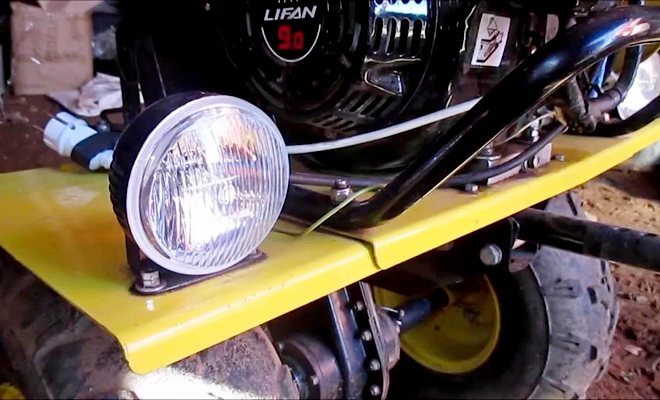 Headlight on a walk-behind tractor.