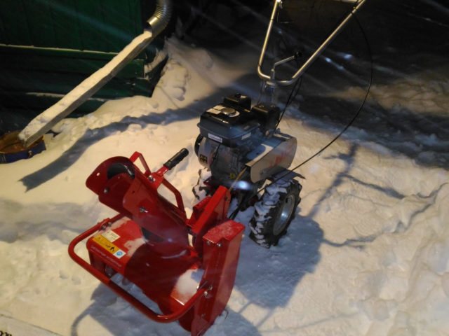 The light on the walk-behind tractor comes from a generator.