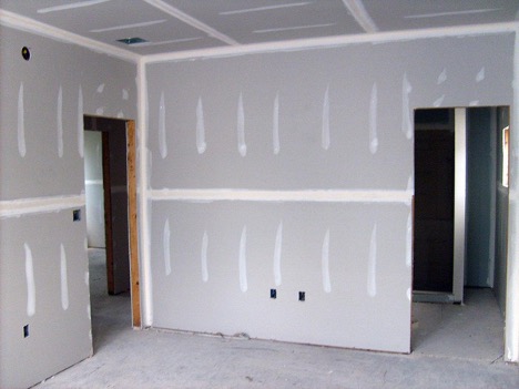 Leveling walls with plasterboard